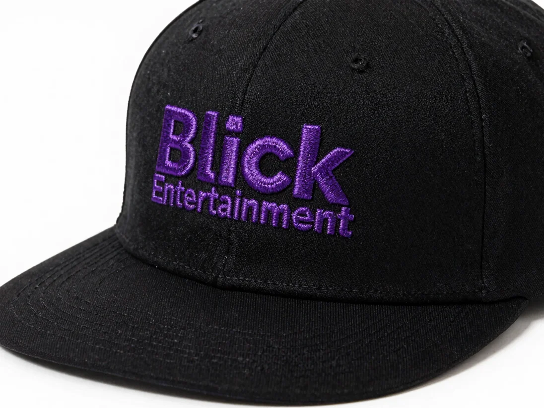 Close-up editorial product photograph of a black embroidered cap
